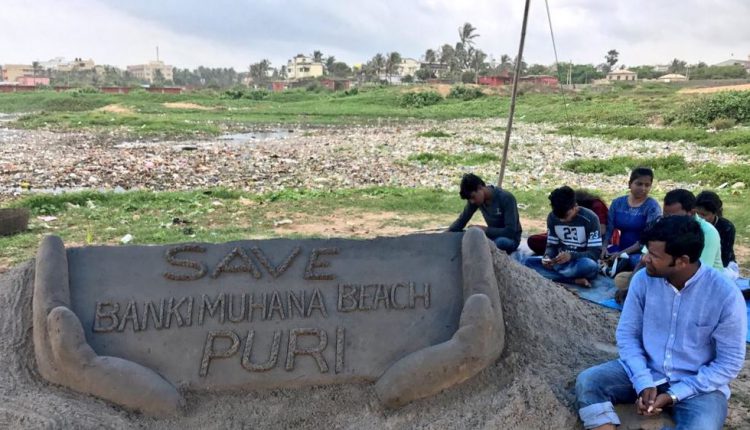 Sudarsan seats on dharana against beach pollution
