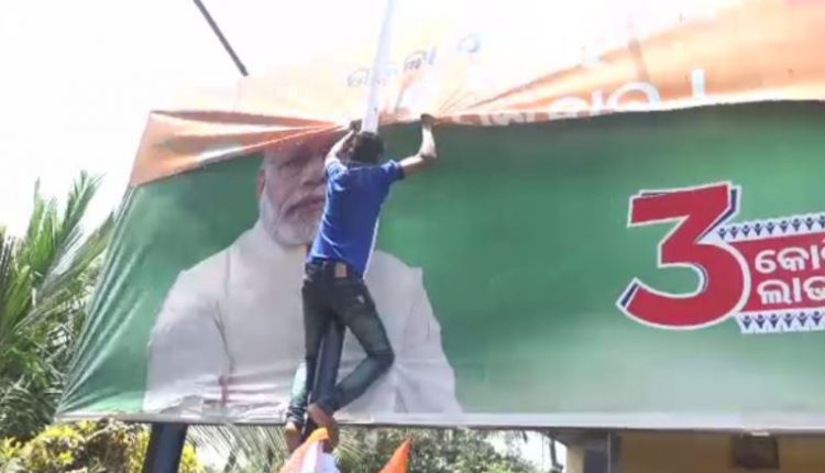 Youth Cong tears down PM’s poster from petrol pups to protest fuel price hike