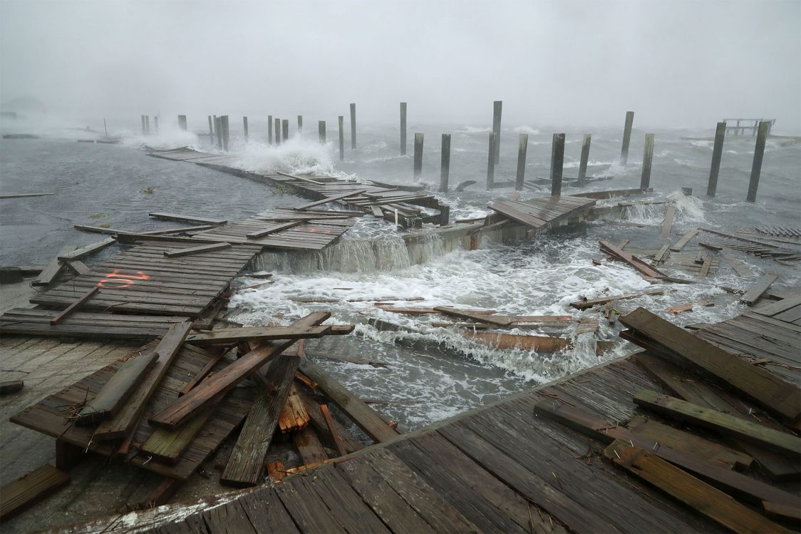 ATLANTIC BEACH, NC - SEPTEMBER 13:  Portions of a boat dock and boardwalk are destroyed by powerful wind and waves as Hurricane Florence arrives September 13, 2018 in Atlantic Beach, United States. Coastal cities in North Carolina, South Carolina and Virginia are under evacuation orders as the Category 2 hurricane approaches the United States.  (Photo by Chip Somodevilla/Getty Images)