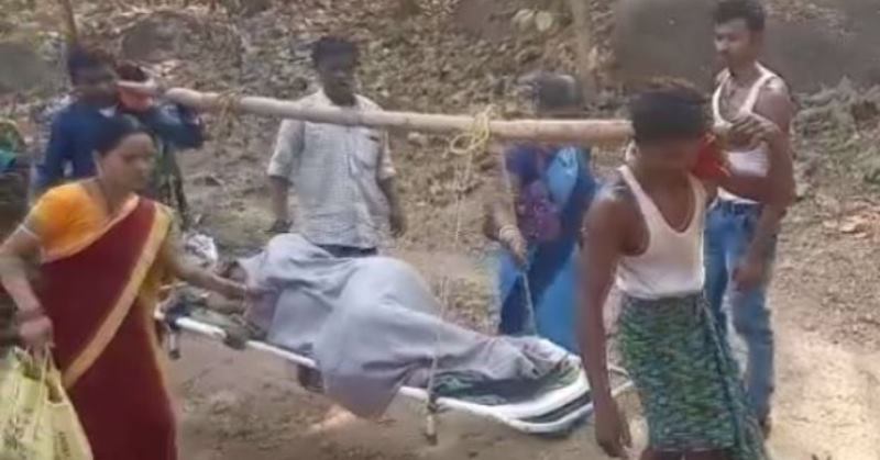 Pregnant lady carried on stretcher