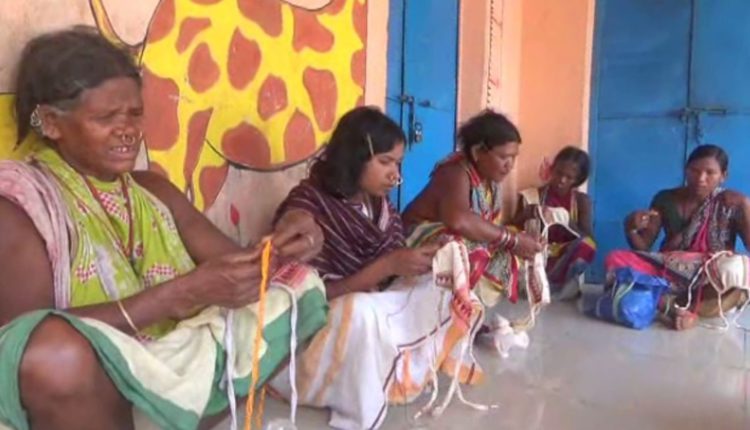 Tribal women make mask in Odisha