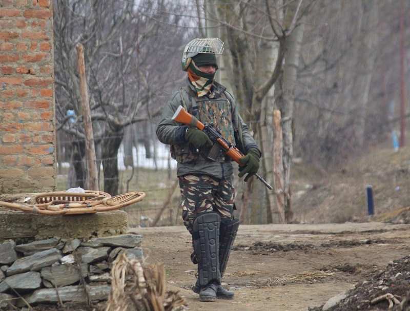Kupwara: A soldier at the site of an encounter with militants in Jammu and Kashmir's Kupwara district on March 1, 2019. Two militants were killed in the gunfight. (Photo: IANS)