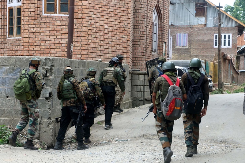 Kulgam: Security personnel carry out cordon and search operations after one terrorist was killed in an encounter at South Kashmir's Kulgam district on July 4, 2020. The encounter started after security forces got an input about the presence of terrorists in Arrah area of Kulgam. (hoto: IANS)