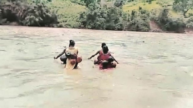 Anganwadi Workers Swim And Trek To Reach Remote Odisha Village