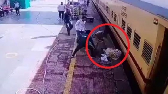 cop saves man from falling under train