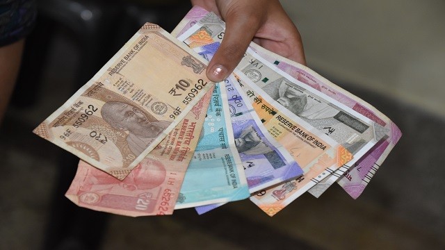 Rupee weakens in comparison to dollar