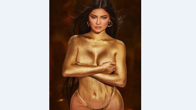 Kylie Jenner shimmers in gold dust body paint