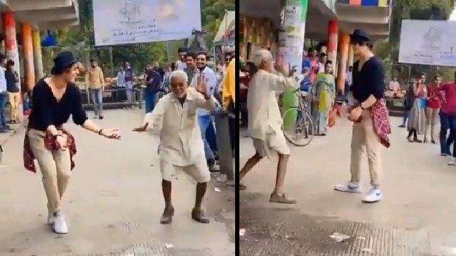 old man dances with foreigner