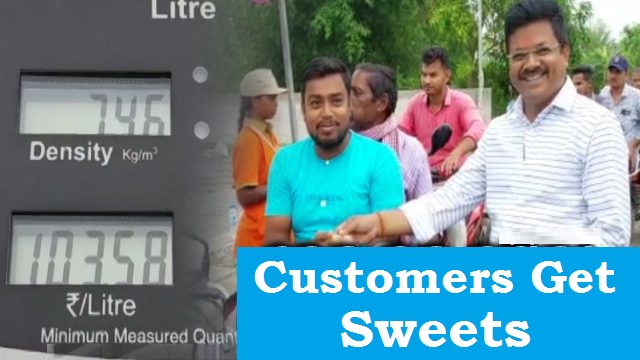 Petrol pump owner distributes sweets to welcome customers