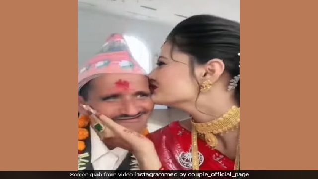 bride kisses man in viral wedding video