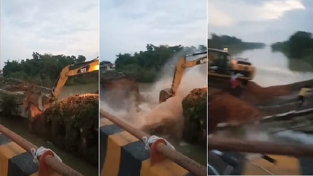 bulldozer falls into water