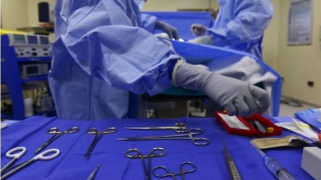 businessman helps surgeons at operation theatre