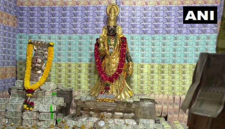 temple in Andhra decorated with currency notes