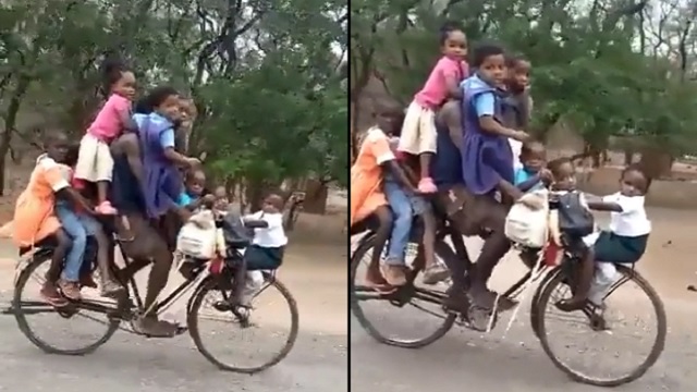 man riding cycle with nine kids
