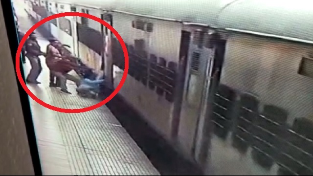 man while getting dragged by moving train