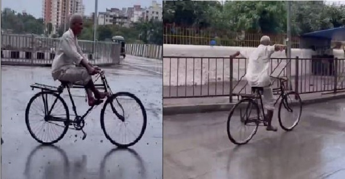 Elderly man performs stunt bicycle