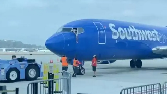 pilot hanging out of window