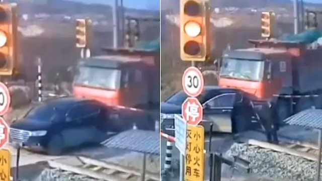 SUV driver escapes death by train