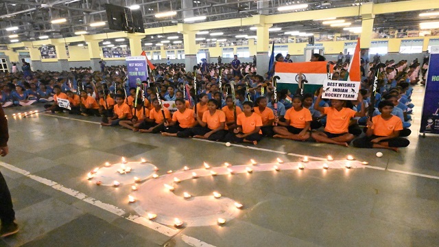 Students of KISS students pray for Indian Men's Hockey team