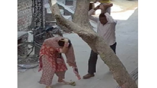 Man hits woman with brick