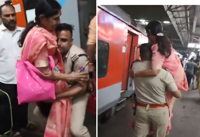 railway cop carries elderly woman