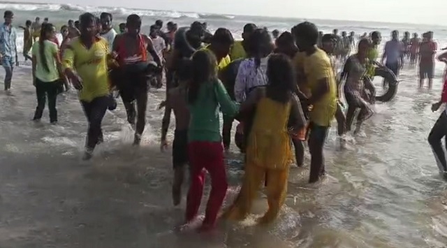 tourists rescued from drowning in sea in puri