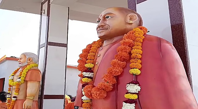 unlawful roof temple with modi and yogi statues