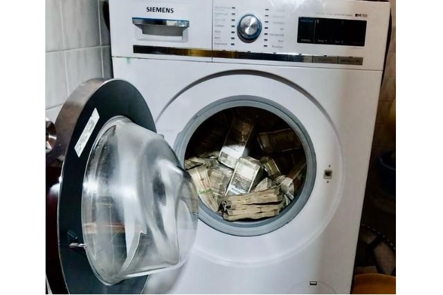 Rs 2.54 crore cash hidden in washing machine
