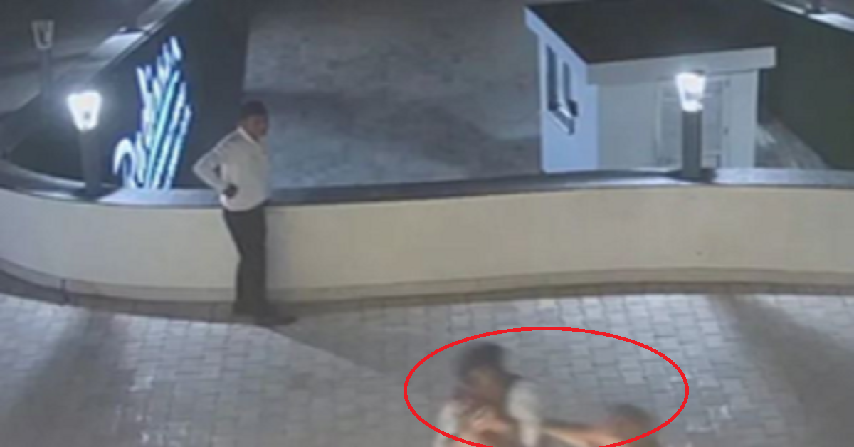 businessman pushes man off hotel's terrace