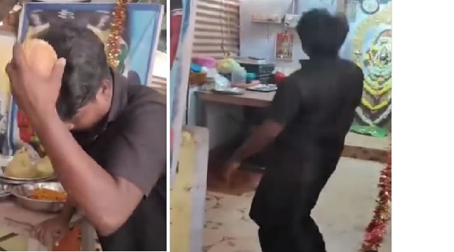 Man breaks coconut with head